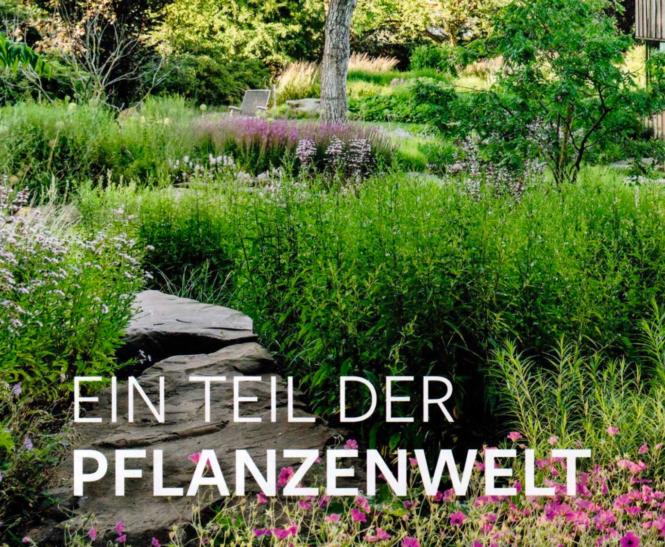 Farbenfrohes Gartenbild mit Titel "Ein Teil der Pflanzenwelt"